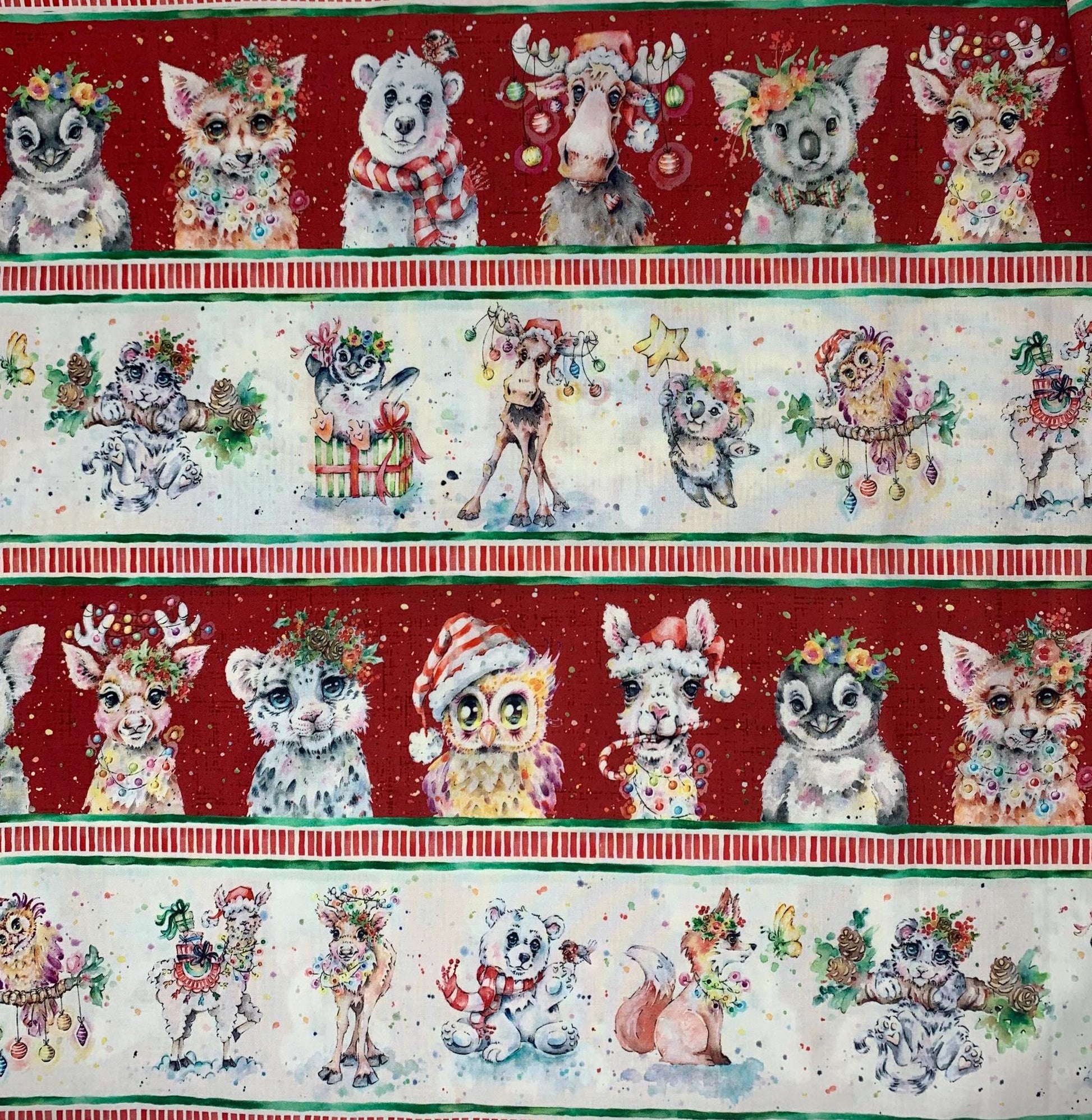 Little Darlings Character Border Stripe Christmas featuring owls, foxes, camels,polar and koala bears tangled in Christmas lights.