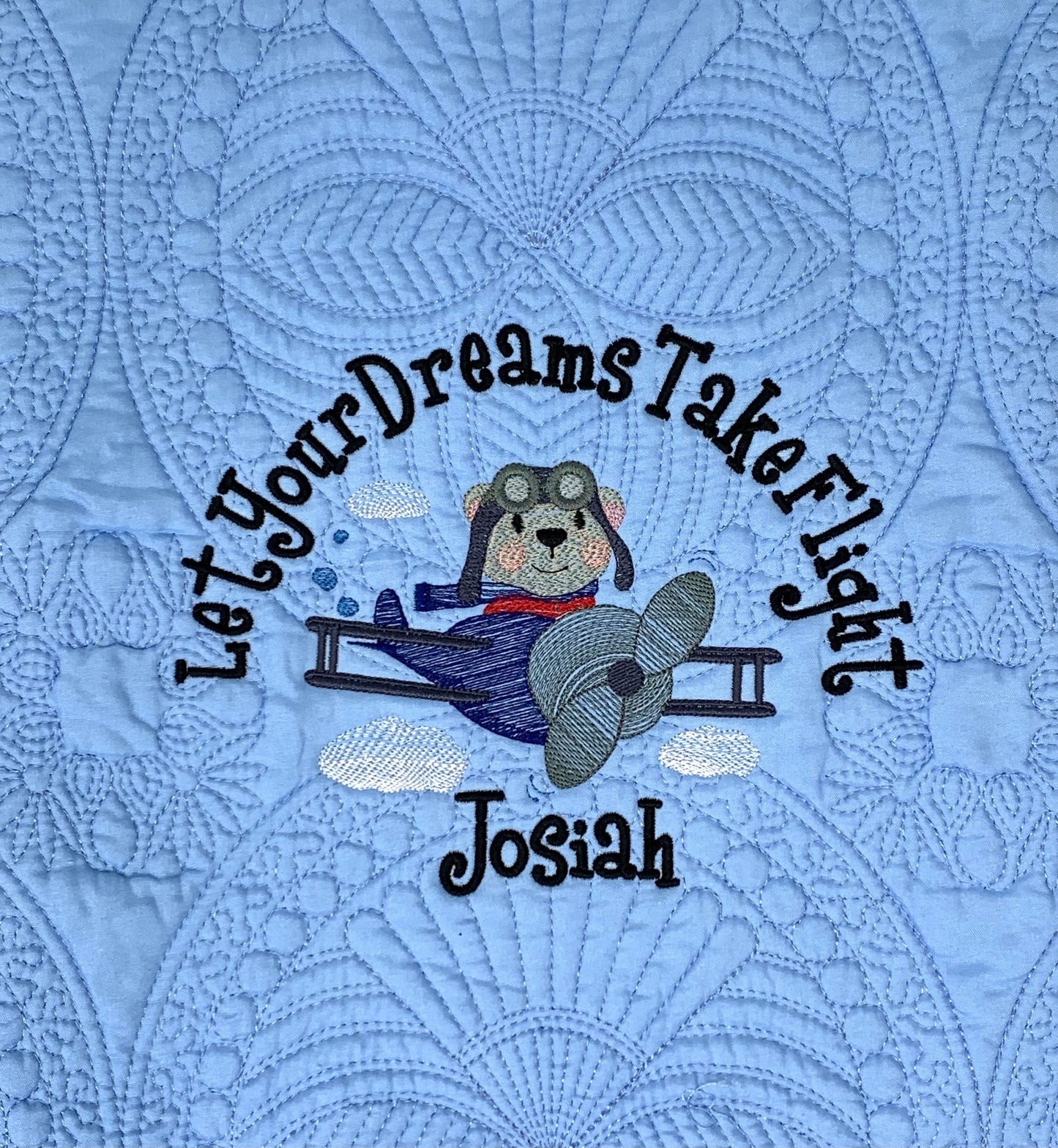 Aviator bear pilot on blue baby boy heirloom quilt.