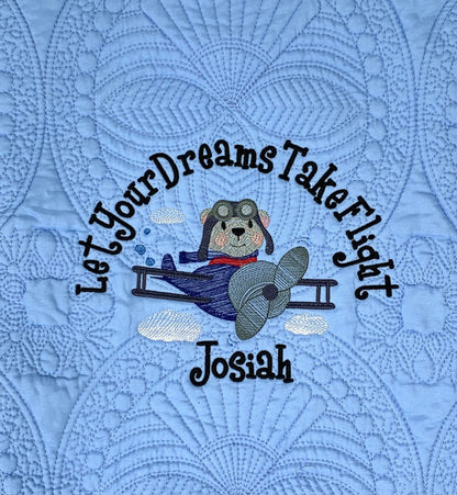 Aviator bear pilot on blue baby boy heirloom quilt.