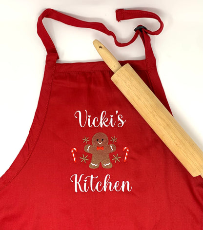 Red, personalized apron with embroidered
gingerbread man.